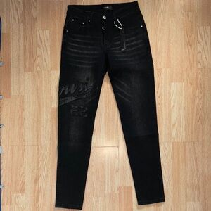 AMIRI Black Skinny Jeans with Subtle Embossed Logo